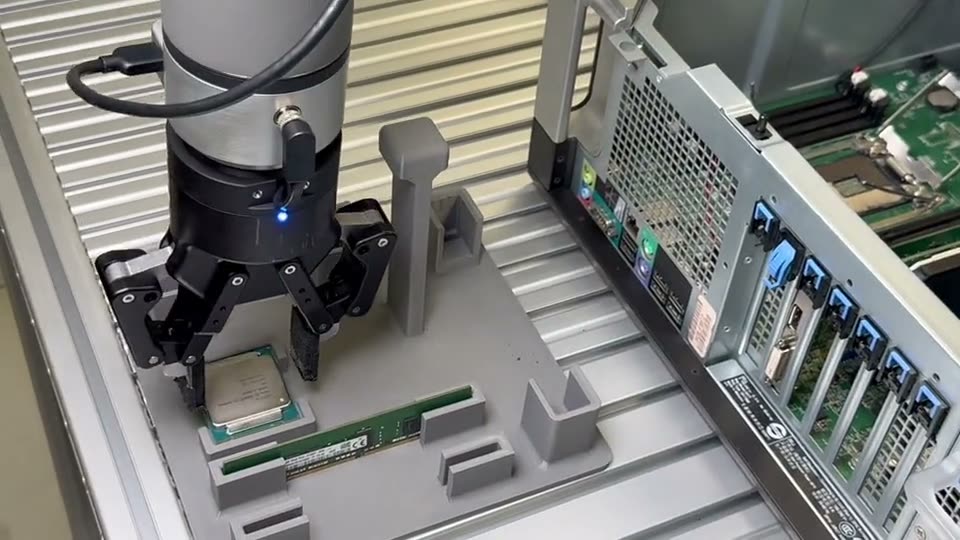 UR7e arm performing CPU placement inside a PC chassis